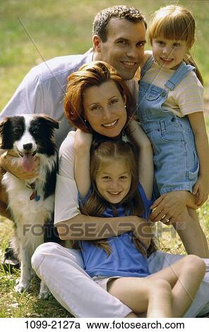 people, smiling, dog, pet, holding, outdoors, smile View Large Photo Image Stock Image - people, smiling, dog, pet, holding, outdoors, smile. Fotosearch