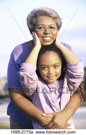 people, smiling, eyeglasses, outdoors, hugging, smile, family View Large Photo Image Stock Image - people, smiling, eyeglasses, outdoors, hugging, smile, family. Fotosearch