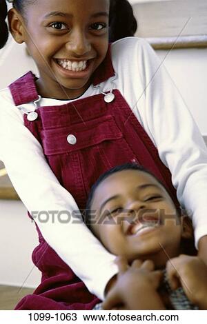 people, smiling, friendship, happy, laughing, playful, outdoors View Large Photo Image Stock Image - people, smiling, friendship, happy, laughing, playful, outdoors. Fotosearch