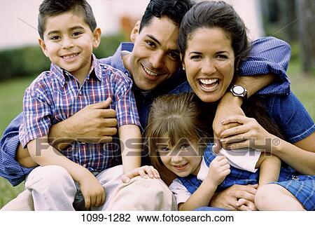 people, smiling, Hispanic, laughing, outdoors, family, posing View Large Photo Image Stock Image - people, smiling, Hispanic, laughing, outdoors, family, posing. Fotosearch