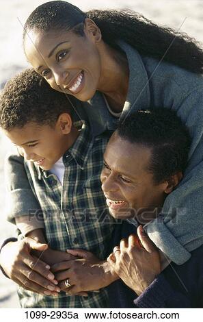 people, smiling, holding, outdoors, hugging, smile, family View Large Photo Image Stock Image - people, smiling, holding, outdoors, hugging, smile, family. Fotosearch