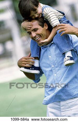 people, smiling, laughing, riding, playful, outdoors, hugging View Large Photo Image Stock Image - people, smiling, laughing, riding, playful, outdoors, hugging. Fotosearch