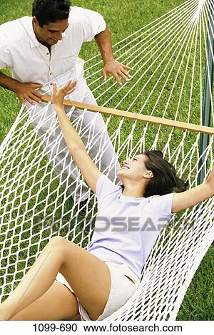 people, smiling, lawn, rope, couple, Hispanic, happy View Large Photo Image Stock Image - people, smiling, lawn, rope, couple, Hispanic, happy. Fotosearch