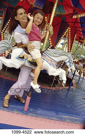 Stock Image - people, smiling, mother, carnival, outdoors, park, amusement. Fotosearch