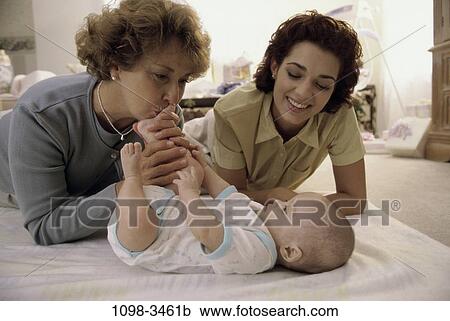 Stock Image - people, smiling, mother, Hispanic, three, smile. Fotosearch