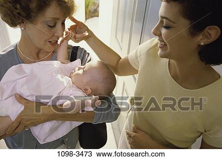 people, smiling, mother, Hispanic, holding, three View Large Photo Image Stock Image - people, smiling, mother, Hispanic, holding, three. Fotosearch