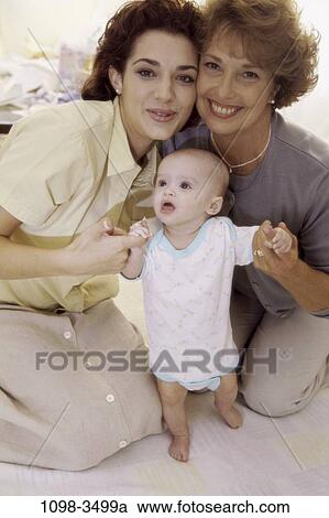 people, smiling, mother, Hispanic, holding, three, smile View Large Photo Image Stock Image - people, smiling, mother, Hispanic, holding, three, smile. Fotosearch