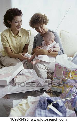 people, smiling, mother, Hispanic, birthday, holding, three View Large Photo Image Stock Photography - people, smiling, mother, Hispanic, birthday, holding, three. Fotosearch