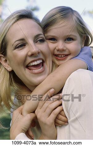 people, smiling, mother, laughing, holding, playful, hugging View Large Photo Image Stock Image - people, smiling, mother, laughing, holding, playful, hugging. Fotosearch