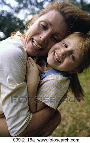 people, smiling, mother, playful, outdoors, nurturing, hugging View Large Photo Image Stock Image - people, smiling, mother, playful, outdoors, nurturing, hugging. Fotosearch