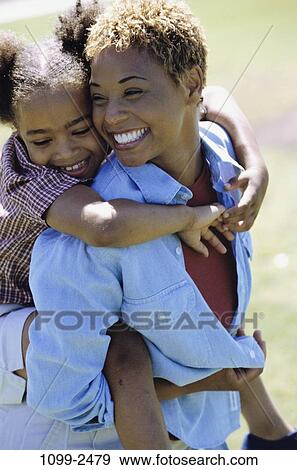 people, smiling, mother, riding, outdoors, carrying, smile View Large Photo Image Stock Photo - people, smiling, mother, riding, outdoors, carrying, smile. Fotosearch