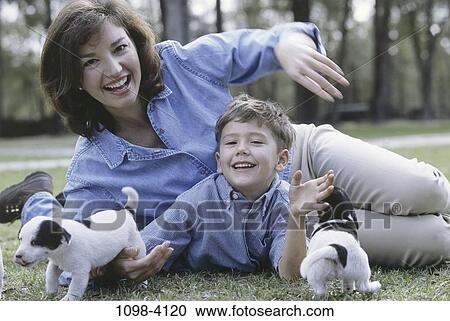 people, smiling, playing, animals, puppies, mother View Large Photo Image Stock Image - people, smiling, playing, animals, puppies, mother. Fotosearch
