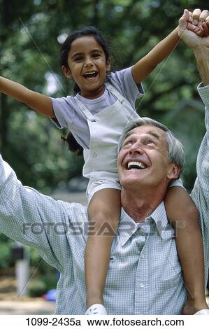 people, smiling, playing, excitement, laughing, riding, playful View Large Photo Image Stock Image - people, smiling, playing, excitement, laughing, riding, playful. Fotosearch