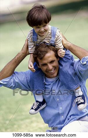 Stock Image - people, smiling, playing, excitement, happy, holding, playful. Fotosearch