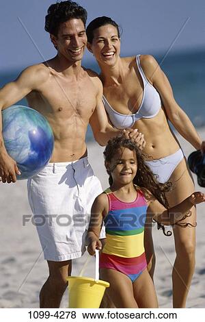 people, smiling, playing, Hispanic, ball, beach, holding View Large Photo Image Stock Photo - people, smiling, playing, Hispanic, ball, beach, holding. Fotosearch