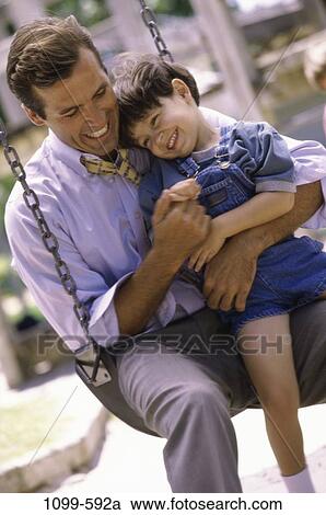 people, smiling, playing, laughing, swing, outdoors, amused View Large Photo Image Stock Image - people, smiling, playing, laughing, swing, outdoors, amused. Fotosearch
