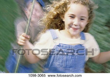 people, smiling, playing, swinging, swing, motion, outdoors View Large Photo Image Stock Photography - people, smiling, playing, swinging, swing, motion, outdoors. Fotosearch