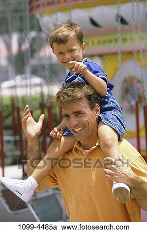people, smiling, riding, pointing, outdoors, park, amusement View Large Photo Image Stock Image - people, smiling, riding, pointing, outdoors, park, amusement. Fotosearch