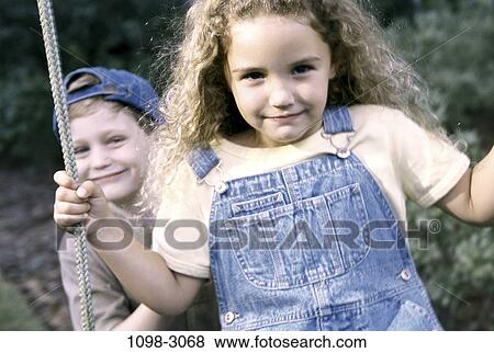 people, smiling, rope, playing, staring, swinging View Large Photo Image Stock Photo - people, smiling, rope, playing, staring, swinging. Fotosearch