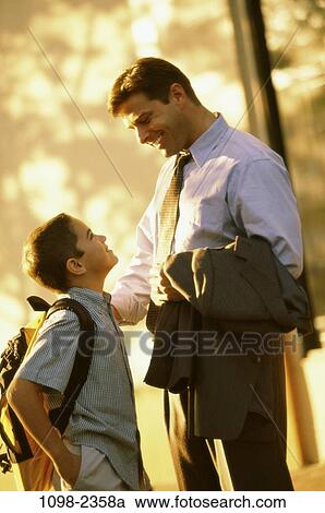 people, smiling, talking, backpack, outdoors, father View Large Photo Image Stock Image - people, smiling, talking, backpack, outdoors, father. Fotosearch