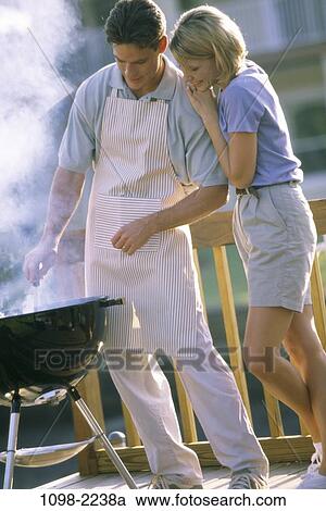people, smoke, couple, cooking, outdoors, deck, touching View Large Photo Image Stock Image - people, smoke, couple, cooking, outdoors, deck, touching. Fotosearch