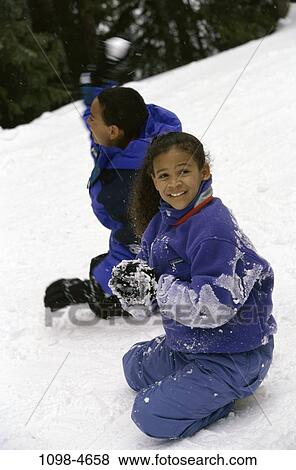 people, snow, smiling, playing, winter, cold, outdoors View Large Photo Image Stock Photo - people, snow, smiling, playing, winter, cold, outdoors. Fotosearch