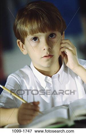 people, staring, pencil, school, boy, curious, writing View Large Photo Image Stock Photo - people, staring, pencil, school, boy, curious, writing. Fotosearch