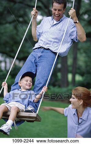 people, swinging, swing, outdoors, joyous, family View Large Photo Image Picture - people, swinging, swing, outdoors, joyous, family. Fotosearch
