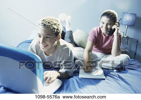 people, telephone, talking, computer, laptop, phone, using View Large Photo Image Stock Image - people, telephone, talking, computer, laptop, phone, using. Fotosearch