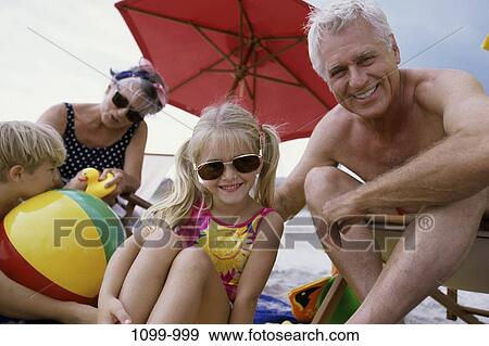 people, umbrella, beach, sunglasses, objects, beach ball, grandparents View Large Photo Image Stock Photo - people, umbrella, beach, sunglasses, objects, beach ball, grandparents. Fotosearch