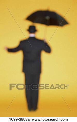 people, umbrella, hat, standing, business, outdoors View Large Photo Image Stock Image - people, umbrella, hat, standing, business, outdoors. Fotosearch