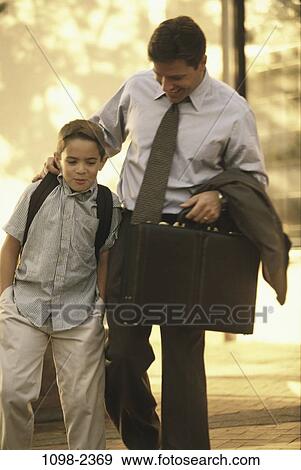 Stock Photo - people, walking, briefcase, conversation, laughing, holding, outdoors. Fotosearch