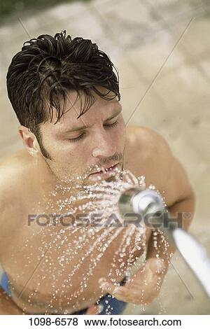 Stock Photo - people, water, beach, cleaning, wet, shower. Fotosearch