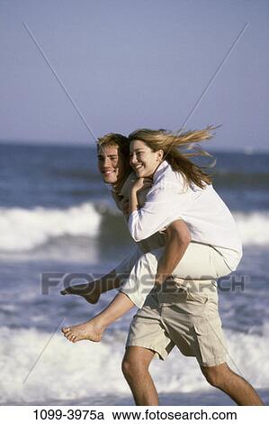people, water, running, smiling, couple, stream, beach View Large Photo Image Stock Image - people, water, running, smiling, couple, stream, beach. Fotosearch