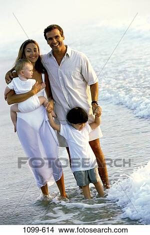 people, water, smiling, beach, toddler, standing, lifestyles View Large Photo Image Picture - people, water, smiling, beach, toddler, standing, lifestyles. Fotosearch