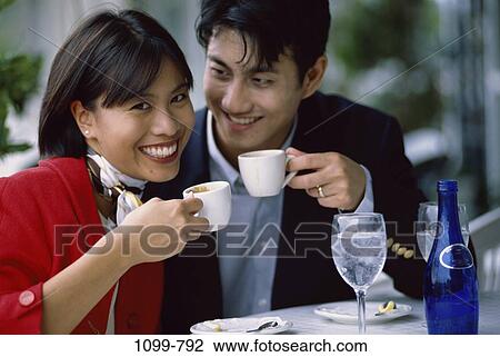 people, water, smiling, glasses, table, Asian, couple View Large Photo Image Stock Image - people, water, smiling, glasses, table, Asian, couple. Fotosearch