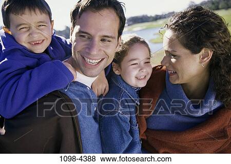 people, water, smiling, happy, holding, outdoors, family View Large Photo Image Stock Photo - people, water, smiling, happy, holding, outdoors, family. Fotosearch