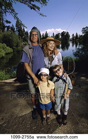 Stock Image - people, water, smiling, hats, trees, outdoors, camping. Fotosearch
