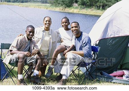 people, water, smiling, sitting, outdoors, camping, tent View Large Photo Image Stock Image - people, water, smiling, sitting, outdoors, camping, tent. Fotosearch