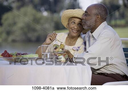 people, water, smiling, table, hat, couple View Large Photo Image Stock Image - people, water, smiling, table, hat, couple. Fotosearch