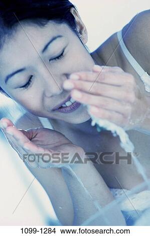 Picture - people, water, woman, Asian, face, Hispanic, splash. Fotosearch