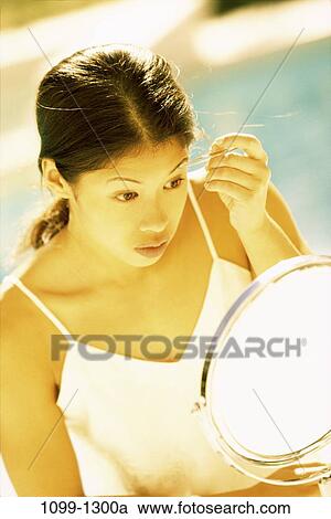 people, woman, Asian, Hispanic, mirror, outdoors, tweezers View Large Photo Image Stock Image - people, woman, Asian, Hispanic, mirror, outdoors, tweezers. Fotosearch