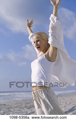 people, woman, beach, joyous, vacation, blond, freedom View Large Photo Image Stock Image - people, woman, beach, joyous, vacation, blond, freedom. Fotosearch