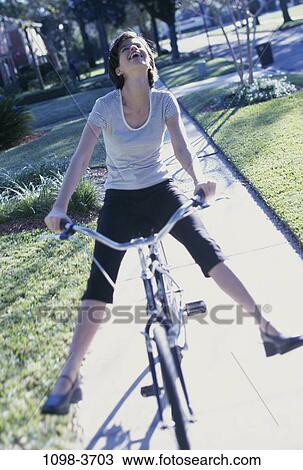 people, woman, excitement, bicycle, happy, laughing, playful View Large Photo Image Stock Image - people, woman, excitement, bicycle, happy, laughing, playful. Fotosearch