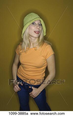 people, woman, hat, individual, tongue, individuality, blond View Large Photo Image Stock Image - people, woman, hat, individual, tongue, individuality, blond. Fotosearch
