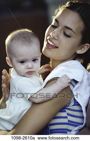 people, woman, mother, holding, family, comforting, daughter View Large Photo Image Stock Image - people, woman, mother, holding, family, comforting, daughter. Fotosearch