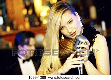 Stock Photography - people, woman, music, entertainment, nightlife, blond. Fotosearch