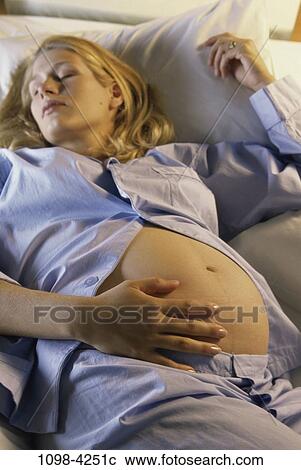 Stock Image - people, woman, pregnancy, young adult, Young women pregnant. Fotosearch