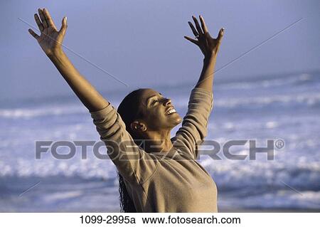 people, woman, smiling, success, raised, beach View Large Photo Image Stock Image - people, woman, smiling, success, raised, beach. Fotosearch