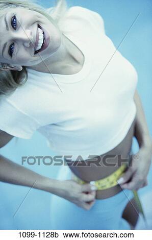 Stock Image - people, woman, tape, healthy, diet, health, blond. Fotosearch
